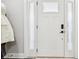 Stylish front door with sidelights, modern hardware, and a transom window at 6707 Meadow View Ct, Avon, IN 46123