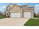Spacious three-car garage with ample driveway space on this beautiful home's exterior at 6707 Meadow View Ct, Avon, IN 46123