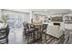 Eat-in kitchen with seating, view of living room and access to patio at 6707 Meadow View Ct, Avon, IN 46123
