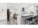 Bright kitchen with large island, stainless steel appliances, and modern lighting at 6707 Meadow View Ct, Avon, IN 46123