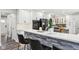 Kitchen island seating area and modern appliances and white cabinets at 6707 Meadow View Ct, Avon, IN 46123