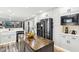 Kitchen with stainless appliances, white cabinets and countertops, wood grain floors, and center island at 6707 Meadow View Ct, Avon, IN 46123
