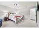 Comfortable main bedroom with carpeted floors, side tables, and a stylish ceiling light at 6707 Meadow View Ct, Avon, IN 46123