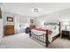 Bright main bedroom featuring a decorative bed frame, carpeted floor, and large window at 6707 Meadow View Ct, Avon, IN 46123