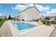 Relax and unwind in the backyard with a pool, patio, and stylish outdoor seating at 6707 Meadow View Ct, Avon, IN 46123