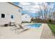 Backyard features an in-ground pool, lounge chairs, grill, and white vinyl siding at 6707 Meadow View Ct, Avon, IN 46123