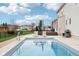 Backyard featuring a sparkling pool, patio dining set, lounge seating, and meticulously landscaped yard at 6707 Meadow View Ct, Avon, IN 46123