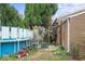 Backyard with an above ground pool, access to home via stairs, and patio at 6853 Cordova Dr, Indianapolis, IN 46221