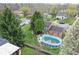 Backyard with an above ground pool, a deck, fire pit, and lawn at 6853 Cordova Dr, Indianapolis, IN 46221