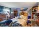 Bedroom with a unique headboard and lots of stuff on every surface at 6853 Cordova Dr, Indianapolis, IN 46221