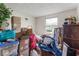Image displays a bedroom filled with various belongings, reflecting lived-in comfort and personal style at 6853 Cordova Dr, Indianapolis, IN 46221