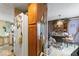Shows a dining area with a vintage hutch, table, and chairs, capturing a traditional aesthetic at 6853 Cordova Dr, Indianapolis, IN 46221