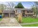 Traditional two-story home with a two-car garage, inviting curb appeal, and well-maintained landscaping at 6853 Cordova Dr, Indianapolis, IN 46221