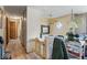 Hallway featuring wood-look flooring and access to various rooms in the home at 6853 Cordova Dr, Indianapolis, IN 46221