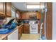Traditional kitchen offering a functional layout, wood cabinets, and all essential appliances at 6853 Cordova Dr, Indianapolis, IN 46221