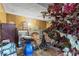 An untidy living room featuring wood paneling and a ceiling fan at 6853 Cordova Dr, Indianapolis, IN 46221