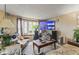 Cozy living room with a large window, comfortable seating, and a mounted television for entertainment at 6853 Cordova Dr, Indianapolis, IN 46221