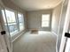 Room features a wall of windows, light-colored walls, and an unfinished floor at 7308 Broadview Ln, McCordsville, IN 46055