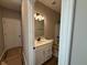 Well-lit bathroom featuring a single vanity with a white countertop and white cabinets at 7421 Broadview Ln, McCordsville, IN 46055