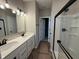 Bathroom with double sink vanity, modern fixtures, and a glass-enclosed shower at 7421 Broadview Ln, McCordsville, IN 46055