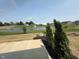Scenic backyard with a serene pond, complete with a fountain, offering a peaceful outdoor view at 7421 Broadview Ln, McCordsville, IN 46055
