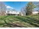Spacious backyard view featuring a well-maintained lawn and shade trees at 7624 Snowflake Dr, Indianapolis, IN 46227