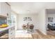 Dining area with a round table, four chairs, and sliding glass doors leading to outdoor deck at 7624 Snowflake Dr, Indianapolis, IN 46227