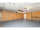 Clean, spacious garage featuring ample lighting and overhead storage at 7624 Snowflake Dr, Indianapolis, IN 46227