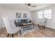 Cozy living room with hardwood floors, neutral-toned furniture, and natural light streaming through the window at 7624 Snowflake Dr, Indianapolis, IN 46227