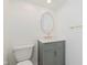 Charming powder room features a stylish vanity, a gold framed mirror and modern fixtures at 8535 Olde Mill Circle West Dr, Indianapolis, IN 46260