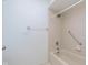 Well-lit bathroom featuring a tile shower and tub with chrome fixtures and accessories at 8535 Olde Mill Circle West Dr, Indianapolis, IN 46260