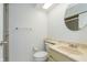 Clean bathroom featuring a cream-colored sink with marble countertop and modern toilet at 8535 Olde Mill Circle West Dr, Indianapolis, IN 46260
