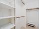 Organized walk-in closet featuring ample shelving and hanging space for efficient storage at 8535 Olde Mill Circle West Dr, Indianapolis, IN 46260