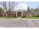 Charming building with brick facade, well-maintained landscaping, and ample parking at 8535 Olde Mill Circle West Dr, Indianapolis, IN 46260