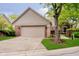 Charming home featuring brick and siding, complemented by a well-maintained lawn and attached two-car garage at 8535 Olde Mill Circle West Dr, Indianapolis, IN 46260