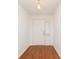 Inviting foyer featuring hardwood floors, white walls, and a classic white front door at 8535 Olde Mill Circle West Dr, Indianapolis, IN 46260