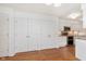 Bright kitchen featuring stainless steel appliances, white cabinets, and hardwood floors at 8535 Olde Mill Circle West Dr, Indianapolis, IN 46260