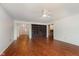 Spacious living room featuring hardwood floors and built-in shelving at 8535 Olde Mill Circle West Dr, Indianapolis, IN 46260