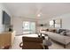 Inviting living room with stylish furniture, ceiling fan, and sliding glass door at 8535 Olde Mill Circle West Dr, Indianapolis, IN 46260