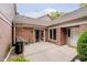 Private patio with awning, perfect for outdoor grilling, with brick exterior and sliding glass door access at 8535 Olde Mill Circle West Dr, Indianapolis, IN 46260