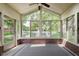 The sunroom offers panoramic views of the pond and surrounding landscaped grounds at 8535 Olde Mill Circle West Dr, Indianapolis, IN 46260