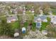 Residential area aerial view of houses, trees, and swimming pools on a sunny day at 8747 Knotty Pine Ct, Indianapolis, IN 46227