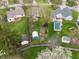 Spacious backyard featuring a shed, garden, and a neighboring home with an in-ground pool at 8747 Knotty Pine Ct, Indianapolis, IN 46227
