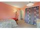 Cozy bedroom featuring light fixtures, a door and a large closet at 8747 Knotty Pine Ct, Indianapolis, IN 46227