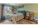 Stylish bedroom featuring a window with natural light and colorful decor at 8747 Knotty Pine Ct, Indianapolis, IN 46227