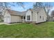 Inviting home with manicured landscaping, showcasing its charming curb appeal and well-kept exterior at 8747 Knotty Pine Ct, Indianapolis, IN 46227