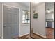 Inviting foyer with hardwood floors, leading to the kitchen area, creating a warm entrance at 8747 Knotty Pine Ct, Indianapolis, IN 46227