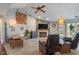 Welcoming living room featuring a fireplace, TV, ceiling fan and walkout to the exterior at 8747 Knotty Pine Ct, Indianapolis, IN 46227