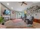 Comfortable living room featuring a fireplace, TV, ceiling fan and walkout to the exterior at 8747 Knotty Pine Ct, Indianapolis, IN 46227