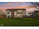 Spacious backyard featuring a large lawn, patio area, and pergola, perfect for outdoor entertaining at 8965 Snowberry Ct, Zionsville, IN 46077